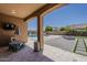 Back patio features a view of the swimming pool, basketball court, fire pit, and outdoor seating at 15655 W Berkeley Rd, Goodyear, AZ 85395