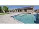 The backyard features a sparkling pool and covered patio, ideal for entertaining or relaxing at 15655 W Berkeley Rd, Goodyear, AZ 85395