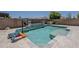 Beautiful backyard featuring a pool, slide, and a built-in hot tub at 15655 W Berkeley Rd, Goodyear, AZ 85395