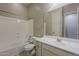 Clean bathroom featuring a combined shower and tub with a white vanity and tile floors at 15655 W Berkeley Rd, Goodyear, AZ 85395