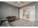 This home boasts a bonus room with adjacent sitting area and wood-look flooring at 15655 W Berkeley Rd, Goodyear, AZ 85395