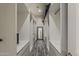 Spacious walk-in closet with custom shelving and ample storage space with hardwood floors at 15655 W Berkeley Rd, Goodyear, AZ 85395