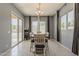 An open dining area with backyard access through a sliding glass door and lots of natural light at 15655 W Berkeley Rd, Goodyear, AZ 85395