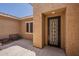 Inviting entryway with a decorative security door and seating area at 15655 W Berkeley Rd, Goodyear, AZ 85395