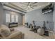 Bright exercise room featuring neutral walls, tray ceiling, and ample natural light at 15655 W Berkeley Rd, Goodyear, AZ 85395