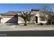Charming single-story home showcasing a well-manicured front yard and a neutral color palette at 15655 W Berkeley Rd, Goodyear, AZ 85395