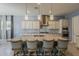 Modern kitchen showcasing a granite island with seating and stainless steel appliances at 15655 W Berkeley Rd, Goodyear, AZ 85395