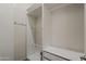 Bright walk-in closet featuring custom shelving and drawers for optimal organization and storage space at 15655 W Berkeley Rd, Goodyear, AZ 85395