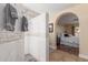 Beautiful bathroom with an open tiled shower and an arched doorway to the main bedroom at 15825 N 45Th St, Phoenix, AZ 85032
