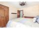 A beautifully lit bedroom with wooden flooring and spacious closets, offers style and functionality at 15825 N 45Th St, Phoenix, AZ 85032