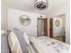 Bright bedroom featuring wood floors, an interior view, decorative bedding, and ample closet space at 15825 N 45Th St, Phoenix, AZ 85032
