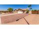 Inviting single-story home featuring desert landscaping, a long driveway, and a two-car garage at 15825 N 45Th St, Phoenix, AZ 85032