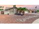 Attractive single-story home featuring desert landscaping, a front courtyard, and a well-manicured lawn at 15825 N 45Th St, Phoenix, AZ 85032