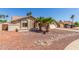 Charming single-story home featuring desert landscaping, a long driveway, and a two-car garage at 15825 N 45Th St, Phoenix, AZ 85032