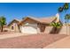 Charming single-story home featuring desert landscaping, a tile roof, and a two-car garage at 15825 N 45Th St, Phoenix, AZ 85032