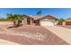 Charming single-story home featuring a well-manicured yard, desert landscaping, and a two-car garage at 15825 N 45Th St, Phoenix, AZ 85032