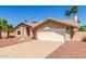 Charming single-story home featuring desert landscaping, a long driveway, and a two-car garage at 15825 N 45Th St, Phoenix, AZ 85032