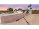 Suburban home with a long driveway, desert landscaping, a two-car garage, and a neutral color scheme at 15825 N 45Th St, Phoenix, AZ 85032