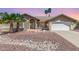 Charming home with well-maintained desert landscaping, a two-car garage, and a welcoming front entrance at 15825 N 45Th St, Phoenix, AZ 85032