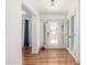 Bright foyer with hardwood floors, decorative chandelier, and modern accents, creating an inviting entryway at 15825 N 45Th St, Phoenix, AZ 85032