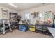 Well-organized garage with storage shelves, workbench, tool chests, and lots of space for various projects at 15825 N 45Th St, Phoenix, AZ 85032