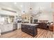 Spacious open-concept kitchen and living area features an island, stainless steel appliances, and hardwood floors at 15825 N 45Th St, Phoenix, AZ 85032