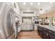 Bright kitchen with stainless steel appliances, a dark island, and white cabinets with great natural light at 15825 N 45Th St, Phoenix, AZ 85032