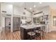 Kitchen with stainless appliances, tile countertops, an island with seating, and a large window at 15825 N 45Th St, Phoenix, AZ 85032