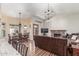 Open living room featuring a fireplace, hardwood floors, and a dining area at 15825 N 45Th St, Phoenix, AZ 85032