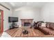 Inviting living room features a fireplace, hardwood floors, and bright natural light at 15825 N 45Th St, Phoenix, AZ 85032