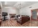 Comfortable living room features a fireplace, chandelier, and hardwood floors at 15825 N 45Th St, Phoenix, AZ 85032
