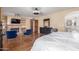 Bright main bedroom featuring a cozy fireplace, wooden floors, and an ensuite bathroom at 15825 N 45Th St, Phoenix, AZ 85032