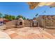 Outdoor kitchen featuring a built-in BBQ, fireplace, and paved patio for summer gatherings at 15825 N 45Th St, Phoenix, AZ 85032