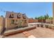 Playhouse featuring a wood deck and stone path, set in a gravel-covered backyard with string lights overhead at 15825 N 45Th St, Phoenix, AZ 85032