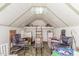 Interior of a finished playhouse with -sized furniture, chairs, a ladder, and vaulted ceiling at 15825 N 45Th St, Phoenix, AZ 85032