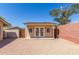 Backyard shed featuring double doors, ideal for a home office, gym, or storage at 15825 N 45Th St, Phoenix, AZ 85032