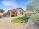 Private backyard featuring an artificial grass area and patio at 16661 W Central St, Surprise, AZ 85388