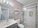 Modern bathroom with a glass shower, gray cabinets, and updated fixtures at 16661 W Central St, Surprise, AZ 85388