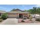 Charming single-story home featuring a well-manicured front yard with desert landscaping and an attached two-car garage at 16661 W Central St, Surprise, AZ 85388