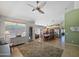 Open concept living area flows seamlessly into the kitchen, with tile floors, large windows, and backyard access at 16661 W Central St, Surprise, AZ 85388
