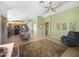 Spacious living area and open eat-in kitchen with tile flooring, wooden cabinets, and modern lighting fixtures at 16661 W Central St, Surprise, AZ 85388