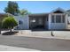 Charming single-story home featuring a covered parking and well-maintained landscaping in a peaceful neighborhood at 17200 W Bell Rd # 1279, Surprise, AZ 85374