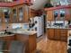Well-lit kitchen with wooden cabinets, sleek countertops, a white refrigerator and lots of space at 17200 W Bell Rd # 1279, Surprise, AZ 85374