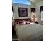 A cozy main bedroom featuring natural lighting, decor and plush bedding for a comfortable living space at 17200 W Bell Rd # 1279, Surprise, AZ 85374