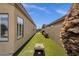 Well-maintained backyard featuring artificial grass, providing a great outdoor space at 20239 N 39Th Dr, Glendale, AZ 85308