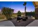 Beautiful backyard patio with lounge seating and desert landscaping at 20239 N 39Th Dr, Glendale, AZ 85308