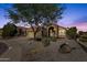 Charming single-story home featuring a well-manicured front yard and inviting stone accents at 20239 N 39Th Dr, Glendale, AZ 85308