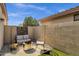 Cozy patio area with comfortable seating and a modern fire pit feature at 20239 N 39Th Dr, Glendale, AZ 85308