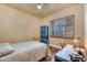 Bedroom featuring a desk area and a shuttered window with hardwood floors at 2103 E Canyon Pl, Chandler, AZ 85249
