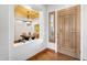 Elegant foyer featuring hardwood floors, a stylish front door, and a view of the adjacent dining room at 2103 E Canyon Pl, Chandler, AZ 85249